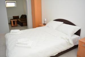 Postel nebo postele na pokoji v ubytování Deltix Apartments