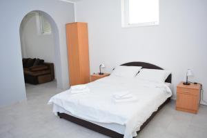 Postel nebo postele na pokoji v ubytování Deltix Apartments