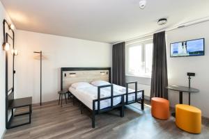 Postel nebo postele na pokoji v ubytování a&o Berlin Mitte