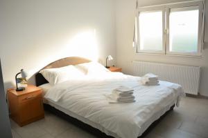 Postel nebo postele na pokoji v ubytování Deltix Apartments