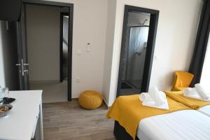 Postel nebo postele na pokoji v ubytování Sagena Rooms