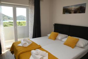 Postel nebo postele na pokoji v ubytování Sagena Rooms