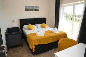 Postel nebo postele na pokoji v ubytování Sagena Rooms