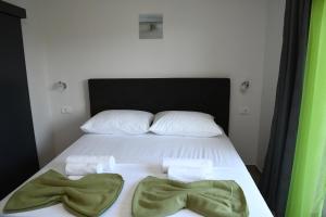 Postel nebo postele na pokoji v ubytování Sagena Rooms