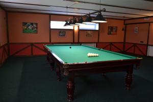 a room with a pool table with balls on it at Три Сімки in Vyshhorod