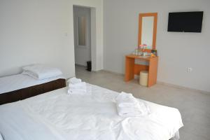 Postel nebo postele na pokoji v ubytování Deltix Apartments