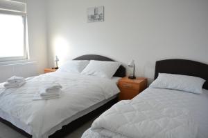 Postel nebo postele na pokoji v ubytování Deltix Apartments