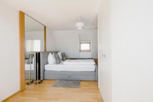 Ein Bett oder Betten in einem Zimmer der Unterkunft Hotel Graf Zeppelin