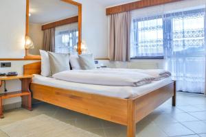 Postel nebo postele na pokoji v ubytování Hotel Pension Residence
