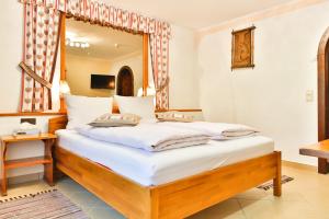 Postel nebo postele na pokoji v ubytování Hotel Pension Residence