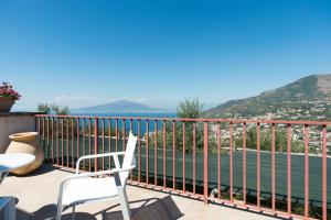 a balcony with a view of the water at Villa Rosa di Nonna Rosa in Vico Equense