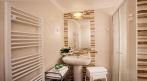 a bathroom with a sink and a mirror at Beach Residence in Gabicce Mare +69 photos