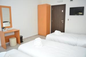 Postel nebo postele na pokoji v ubytování Deltix Apartments