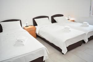 Postel nebo postele na pokoji v ubytování Deltix Apartments