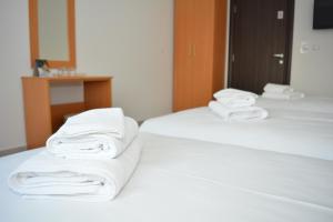 Postel nebo postele na pokoji v ubytování Deltix Apartments