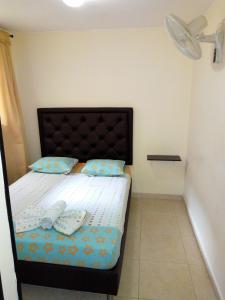 Postel nebo postele na pokoji v ubytování Hotel Táchiras