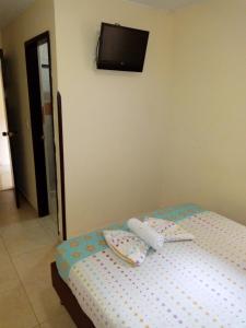 Postel nebo postele na pokoji v ubytování Hotel Táchiras