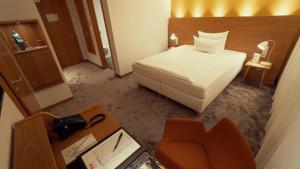 Postel nebo postele na pokoji v ubytování Hotel Adler Asperg