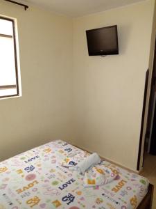 Postel nebo postele na pokoji v ubytování Hotel Táchiras