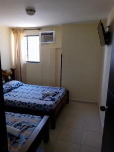 Postel nebo postele na pokoji v ubytování Hotel Táchiras