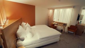 Postel nebo postele na pokoji v ubytování Hotel Adler Asperg