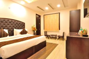 Postel nebo postele na pokoji v ubytování Hotel Kings Inn, Karol Bagh, New Delhi