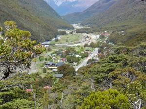 a view of a town in a valley with mountains at Arthur's Pass Alpine Motel in Arthur's Pass