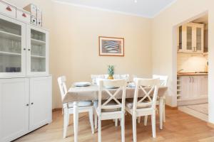 a kitchen and dining room with a table and chairs at Comfortable and Convenient apt in the center - Zanobi Delux in Florence