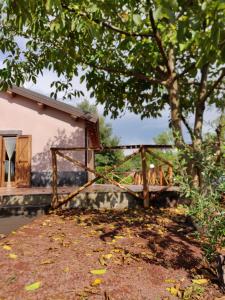 a wooden bridge in front of a house at Mount Etna Chalet in Maletto