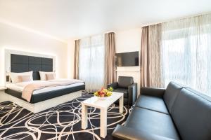 TV a/nebo společenská místnost v ubytování Sieben Welten Hotel & Spa Resort