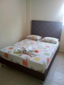 Postel nebo postele na pokoji v ubytování Hotel Táchiras