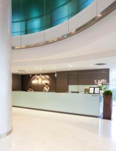 a lobby of a hospital with a reception counter at Viva Garden Serviced Residence in Bangkok