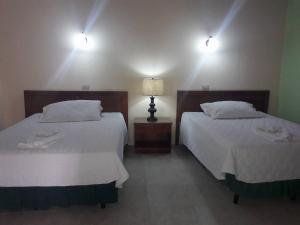 Hotel Pasabien客房内的一张或多张床位