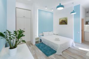 Postel nebo postele na pokoji v ubytování Basseynaya Apart Hotel