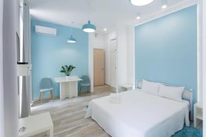 Postel nebo postele na pokoji v ubytování Basseynaya Apart Hotel