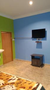 Телевизор и/или развлекательный центр в Mazza Nur Motel
