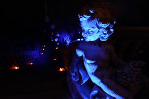 a statue of a woman in blue lights at Hotel Villa Margherita in Quercianella