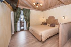 Postel nebo postele na pokoji v ubytování Hotel Capriolo