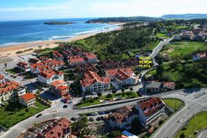 an aerial view of a city and the beach at Hotel Bemon Playa in Somo