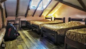 a group of four beds in a room at OkiDoki Cusco Hostal in Cusco