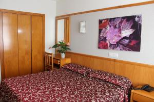 Posteľ alebo postele v izbe v ubytovaní Hotel Esplendid