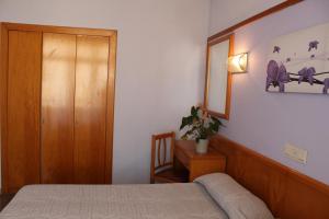 Posteľ alebo postele v izbe v ubytovaní Hotel Esplendid