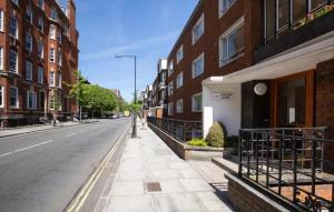 an empty street in a city with buildings at Double room in Marylebone in London