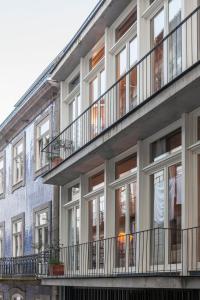 a building with balconies on the side of it at Villa Lóios by Casa do Conto in Porto