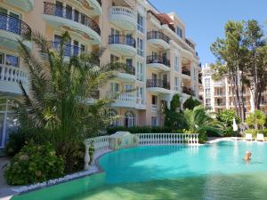 a swimming pool in front of a building at Apartments Anna on the Sunny beach in Sunny Beach