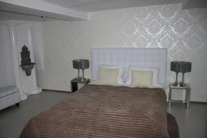 Postel nebo postele na pokoji v ubytování Elements Hotel