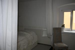 Postel nebo postele na pokoji v ubytování Elements Hotel