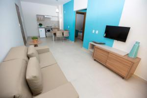 Uma TV ou centro de entretenimento em Ilhas do Lago Eco Resort by WAM Experience