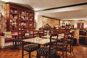 a restaurant with tables and chairs in a room at White Swan Inn in San Francisco