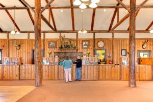 two people standing in a large room with wooden walls at YMCA of the Rockies in Estes Park +21 photos